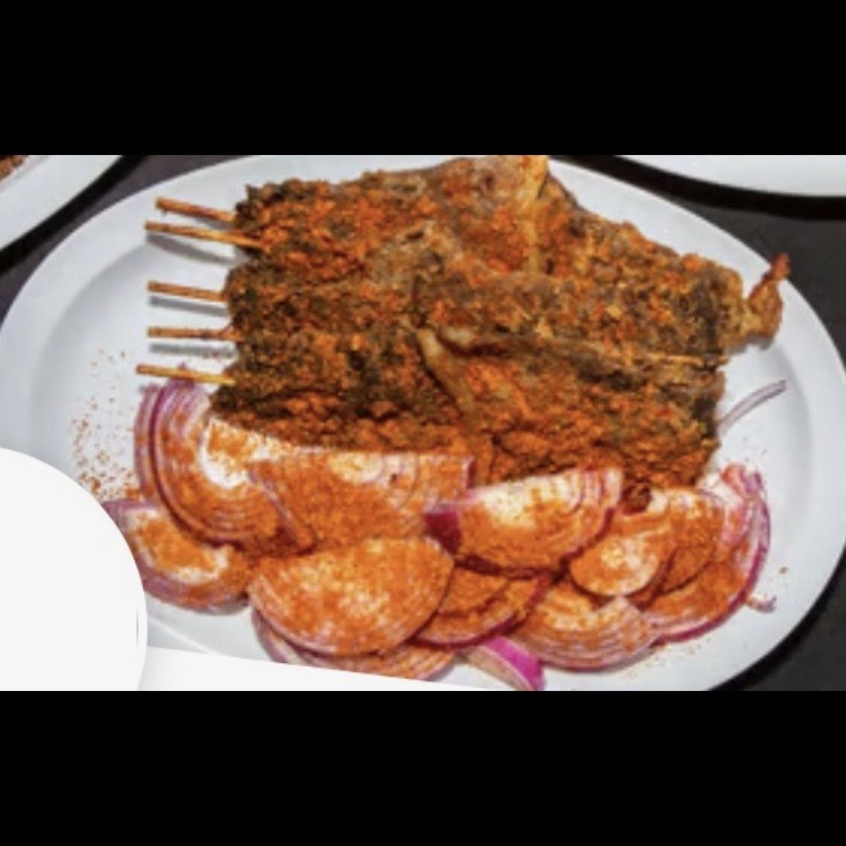 5 suya sticks with sliced onions
